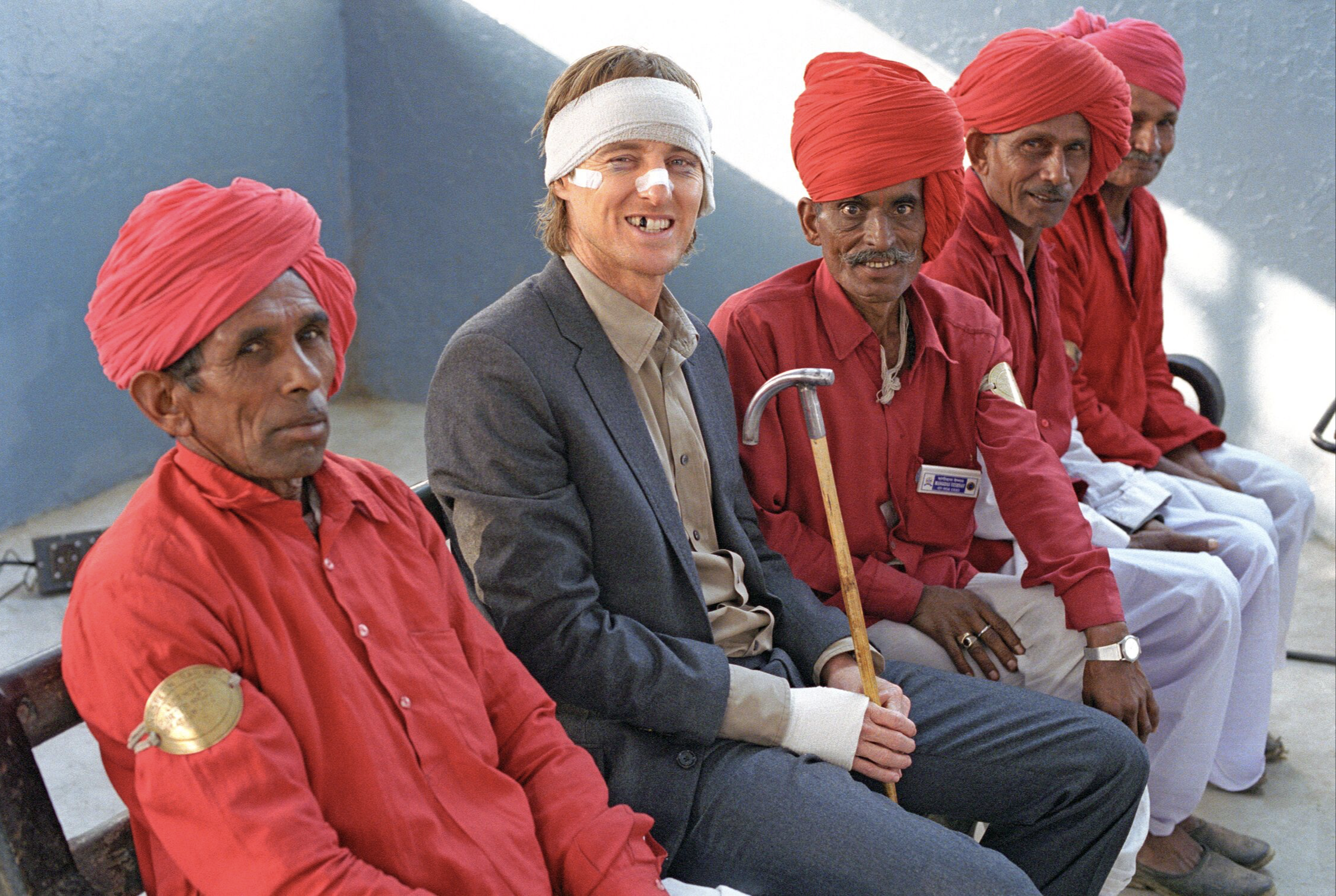 Owen Wilson and extras waiting for a train Rajasthan, India, 2007